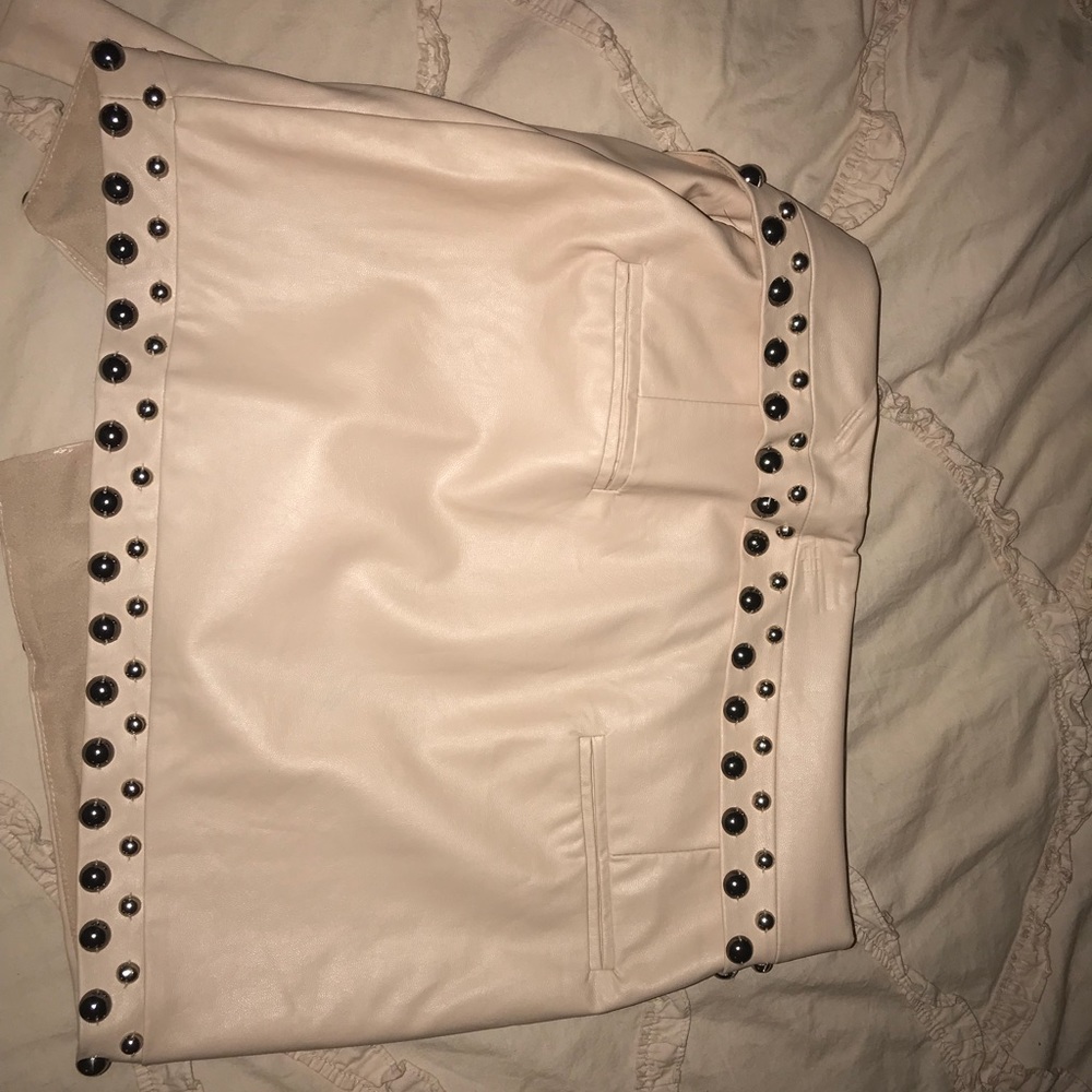 A faux leather skirt w/ silver studs